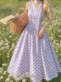 Detailed view of French vintage polka dot halter dress featuring waist cinching and A-line skirt. - S / Violet
