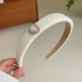 Elegant cream padded headband with rhinestone heart pearl detail for women's style - White Heart