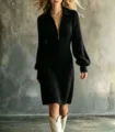 Close-up of women's ribbed knit midi dress featuring a lapel collar and front zipper detail. - S / Black