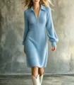 Detailed view of a stylish blue knit dress with zipper collar and long sleeves. Ideal for autumn. - S / Light Blue