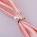 Close-up of elegant silver silk scarf ring buckle with large white pearl detail. - Style 01 Silver