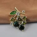 Fashionable gold-plated cherry brooch pin featuring green and clear sparkling crystals - Grapes