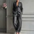 Detailed view of women's casual gray suit jacket and loose wide-leg trousers two-piece set. - XS / Top And Bottom / Dark Gray