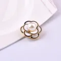 Close-up of elegant white camellia magnetic brooch with pearl center for damage-free wear - White