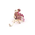 Macro detail of elegant pink flamingo brooch with sparkling crystal rhinestones - Flamingo