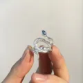 Silver snake ring with blue topaz gemstone, adjustable open band, elegant animal jewelry design. - Blue Topaz Snake / Blue