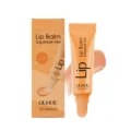 OUHOE moisturizing lip balm squeeze tube with nourishing formula and peach tint for dry lips. - Orange