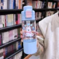 Cute blue plastic water bottle with straw and large capacity, perfect for students and girls daily use. - Blue