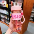 Pink plastic water bottle with straw and pink silicone sleeve, portable summer fruit tea cup. - 650ml / Pink