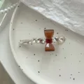 Κομψό καφέ κλιπ μαλλιών με φιόγκο και στρας σε βάση κλιπ πάπιας για λαμπερά χτενίσματα. - Bow Knot Rhinestone Duckbill Clip (Coffee)