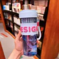 Portable straw water bottle with pink silicone sleeve and clear body for daily office use. - 650ml / Blue