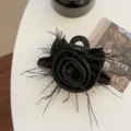 Detail of vintage black rose hair claw clip with delicate feather accents - Hair Claw / Black
