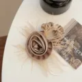 Elegant champagne satin rose hair claw clip with feather detail macro view - Hair Tie / Khaki