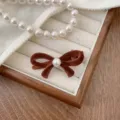 Elegant brown velvet bow hair clip with a center pearl for a classic princess style look. - Brown-Large (240104)