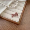 Small dusty rose velvet bow hair clip for women displayed on an elegant jewelry tray - Brown-Small (240104)
