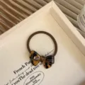 Elegante haarelastiek met een strik van schildpad-acetaat voor dames kapsels. - Tortoise