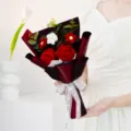 Handcrafted crochet rose bouquet with elegant wrapping ribbon, perfect gift for special occasions. - Red