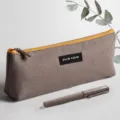 Large capacity canvas pencil case in light coffee triangle style with yellow zipper for students. - Thong Style / Light Coffee