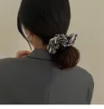 Stylish black and white zebra pattern velvet scrunchie for elegant hair styling. - Scrunchie / Zebra Print