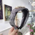 Elegant grey braided headband featuring luxury pearl and rhinestone flower accents for women - Gray