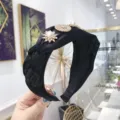 Elegant black braided twist headband with pearl and rhinestone floral embellishments - Black