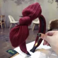 Elegant wine red ribbed fabric bow headband featuring non-slip inner teeth for women - Burgundy