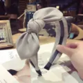 Elegant grey fabric bow headband with a large bow and non-slip teeth for daily wear. - Gray
