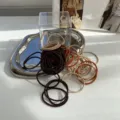 Elegant twisted hair ties in neutral earth tones including brown and beige hues - Orange Series