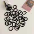 Set of simple black elastic hair ties in a clear storage container - 50 Pcs Bag / Black