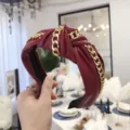 Stylish burgundy PU leather knotted headband with gold chain detail, punk style. - Red