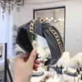 Elegant grey PU leather knotted headband featuring a stylish punk gold chain decoration - Gray