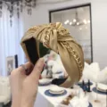 Stylish golden PU leather headband with chain link knot design for fashion women. - Gold