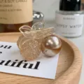 Elegant champagne cherry hair claw clip featuring faceted crystal and metallic spheres - Champagne Pearl