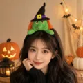 Cute green witch plush headband shown on a model in a warm, festive Halloween setting - 1# Witch