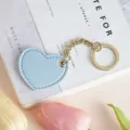 Portachiavi a cuore in pelle azzurro chiaro grazioso ciondolo borsa e anello metallico dorato - Azzurro
