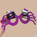 Purple glitter Halloween spider glasses with skull and spider charms for party fun. - Spider Skull