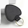 Portachiavi a cuore in pelle nera con anello in metallo dorato e ciondolo borsa - Nero