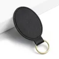Portachiavi ovale in ecopelle PU nera minimalista con anello metallico dorato elegante. - Y-04 Nero