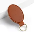 Portachiavi ovale in pelle PU marrone con robusto anello metallico design minimal. - Y-04 Marrone chiaro