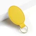 Llavero ovalado de piel sintética amarilla anillo metálico minimalista colgante elegante - Y-04 Amarillo