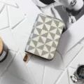 Portafoglio con zip dal design geometrico elegante per donna, compatto e utile. - Stile a mulino a vento con bordo smaltato bianco