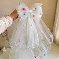 Elegant white girls birthday veil with colorful pom-poms and large bowknot detail - Colorful Pompom Bow Veil Hair Clip