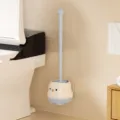 Cute cartoon penguin toilet brush with wall-mounted holder, clean bathroom accessory design. - Blue