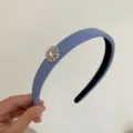 Elegant blue-grey padded headband featuring a sparkling rhinestone snowflake charm - Fog Blue Round Rhinestone