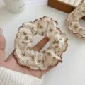 Vintage floral scrunchie with brown lace trim and rustic cream fabric pattern. - Vintage Floral Brown Edge Scrunchie