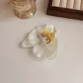 Realistic white orchid flower hair clip with yellow center for bridal hairstyles. - White