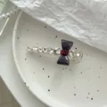 Pince à cheveux douce en cristal faite main avec nœud sombre pour coiffures élégantes - Pince Nœud Gris Strass