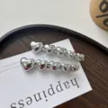 Elegant shiny silver heart-shaped metal hair clips for women in detailed SKU view - Silver Pearlescent Single