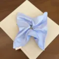 Elegant light blue silk-like square fabric scrunchie featuring a soft satin texture - Blue Windmill Style