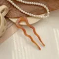 Elegant wavy U-shaped acetate hair fork in amber with a small rhinestone detail. - Wavy U-Shape Style / Coffee Pattern